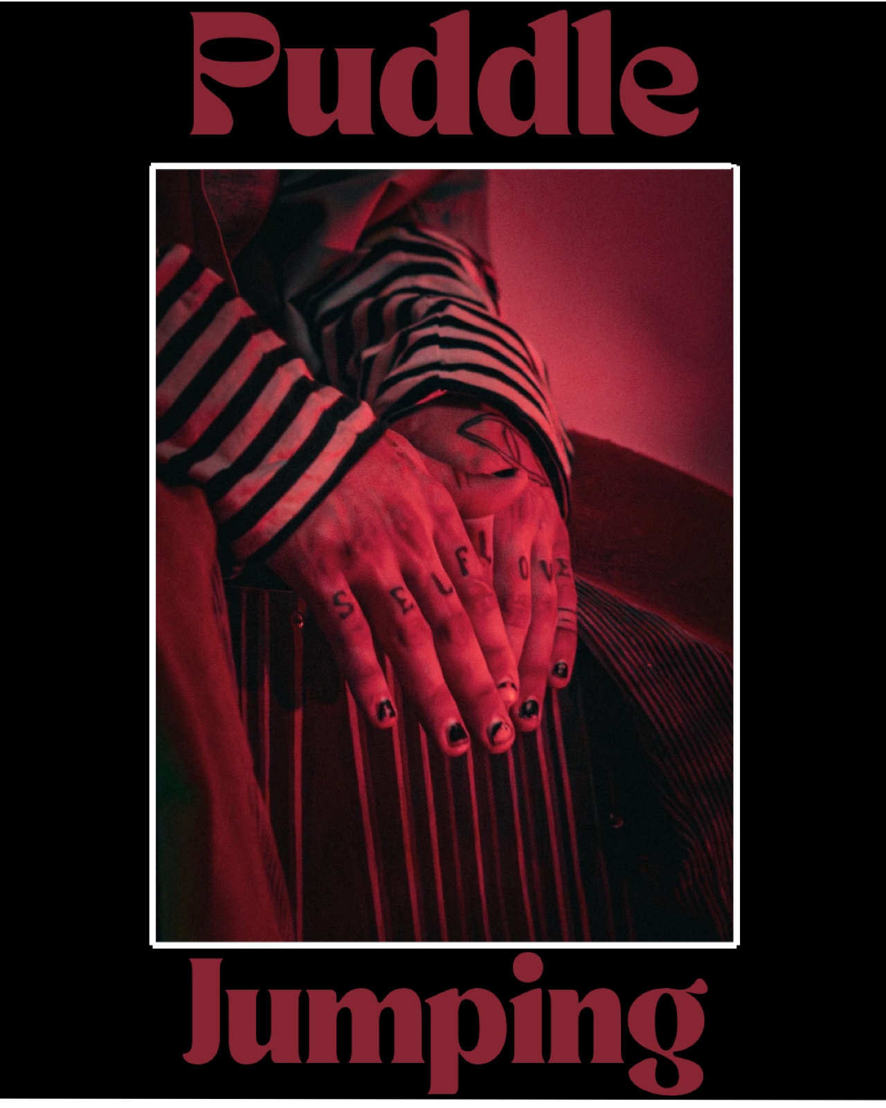 Puddle Jumping poster: tattooed hands reading Self Love in red light
